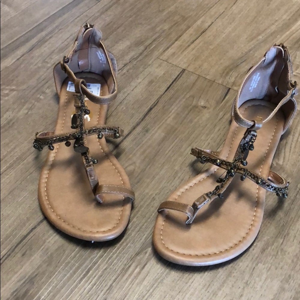 Cute brown sandals with bell embellishments
